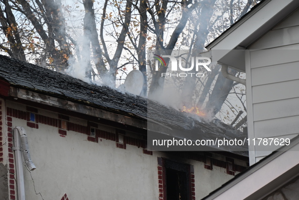 Flames come from the home on Sunday afternoon in Queens Village. One person is killed in a fire that affects a residence at 218-59 110th Ave...