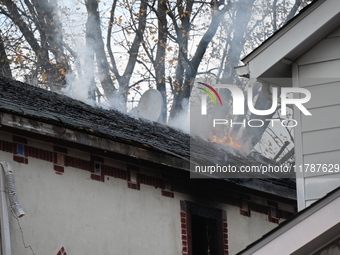 Flames come from the home on Sunday afternoon in Queens Village. One person is killed in a fire that affects a residence at 218-59 110th Ave...