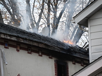 Flames come from the home on Sunday afternoon in Queens Village. One person is killed in a fire that affects a residence at 218-59 110th Ave...