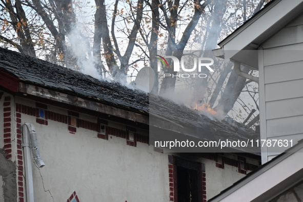 Flames come from the home on Sunday afternoon in Queens Village. One person is killed in a fire that affects a residence at 218-59 110th Ave...