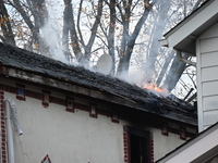 Flames come from the home on Sunday afternoon in Queens Village. One person is killed in a fire that affects a residence at 218-59 110th Ave...