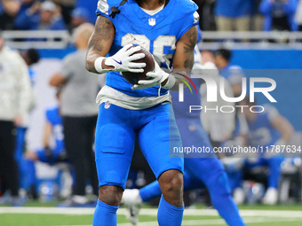 DETROIT,MICHIGAN-November 17: Detroit Lions running back Jahmyr Gibbs (26) reacts after a play during the first half of an NFL football game...