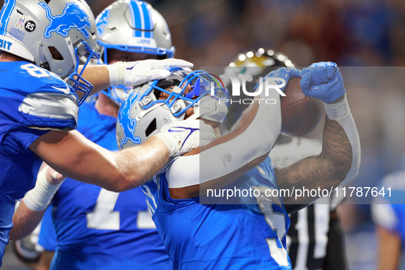 DETROIT,MICHIGAN-NOVEMBER17:  Running back David Montgomery (5) of the Detroit Lions celebrates his touchdown during a game between the Detr...