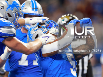 DETROIT,MICHIGAN-NOVEMBER17:  Running back David Montgomery (5) of the Detroit Lions celebrates his touchdown during a game between the Detr...