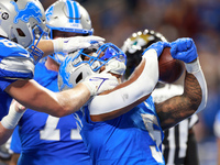 DETROIT,MICHIGAN-NOVEMBER17:  Running back David Montgomery (5) of the Detroit Lions celebrates his touchdown during a game between the Detr...