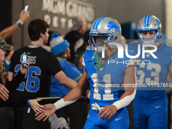 DETROIT,MICHIGAN-November 17: Detroit Lions wide receiver Kalif Raymond (11) heads to the field in the tunnel during an NFL football game be...