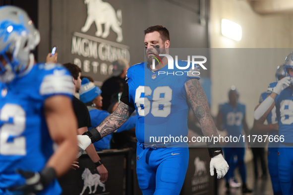 DETROIT,MICHIGAN-November 17: Detroit Lions offensive tackle Taylor Decker (68) heads to the field in the tunnel during an NFL football game...