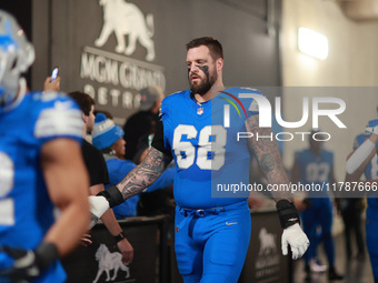 DETROIT,MICHIGAN-November 17: Detroit Lions offensive tackle Taylor Decker (68) heads to the field in the tunnel during an NFL football game...