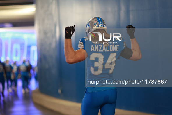 DETROIT,MICHIGAN-November 17: Detroit Lions linebacker Alex Anzalone (34) heads to the field in the tunnel during an NFL football game betwe...