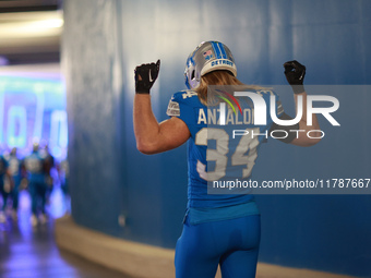 DETROIT,MICHIGAN-November 17: Detroit Lions linebacker Alex Anzalone (34) heads to the field in the tunnel during an NFL football game betwe...