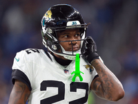 DETROIT,MICHIGAN-NOVEMBER17:  Cornerback Jarrian Jones (22) of the Jacksonville Jaguars adjusts his helmet during a game between the Detroit...