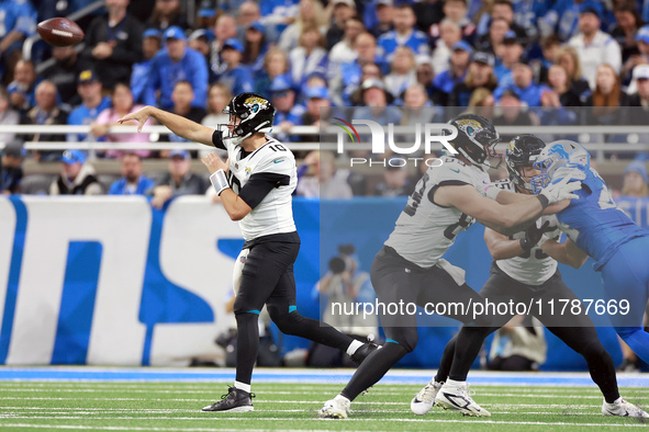 DETROIT,MICHIGAN-NOVEMBER17:  Quarterback Mac Jones (10) of the Jacksonville Jaguars throws the ball during a game between the Detroit Lions...