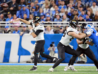 DETROIT,MICHIGAN-NOVEMBER17:  Quarterback Mac Jones (10) of the Jacksonville Jaguars throws the ball during a game between the Detroit Lions...