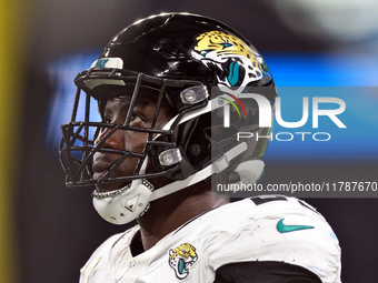 DETROIT,MICHIGAN-NOVEMBER17:  Linebacker Foyesade Oluokun (23) of the Jacksonville Jaguars looks on from the sidelines during a game between...