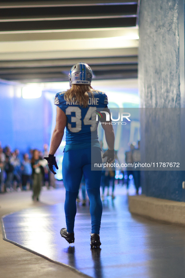 DETROIT,MICHIGAN-November 17: Detroit Lions linebacker Alex Anzalone (34) heads to the field in the tunnel during an NFL football game betwe...