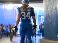 DETROIT,MICHIGAN-November 17: Detroit Lions linebacker Alex Anzalone (34) heads to the field in the tunnel during an NFL football game betwe...