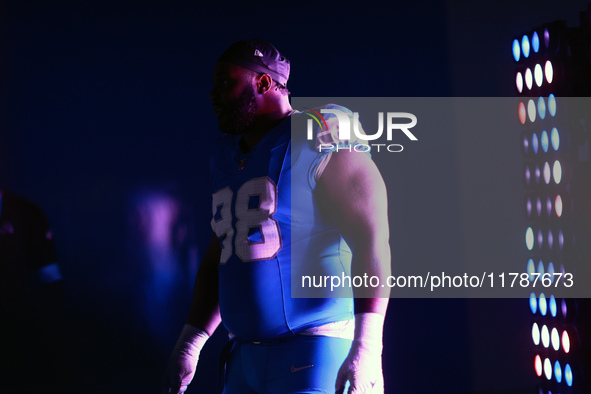 DETROIT,MICHIGAN-November 17: Detroit Lions defensive tackle DJ Reader (98) heads to the field in the tunnel during an NFL football game bet...