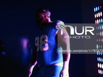 DETROIT,MICHIGAN-November 17: Detroit Lions defensive tackle DJ Reader (98) heads to the field in the tunnel during an NFL football game bet...