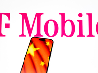 The T-Mobile logo and a Chinese flag are seen in this illustration photo taken in Warsaw, Poland on 17 November, 2024. T-Mobile is one of se...