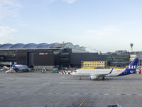 SAS Connect Airbus A320neo aircraft spotted taxiing at London Heathrow Airport LHR in front of the terminal and the air control tower. The m...