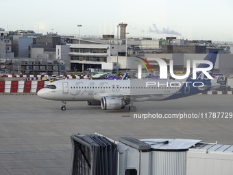 SAS Connect Airbus A320neo aircraft spotted taxiing at London Heathrow Airport LHR in front of the terminal and the air control tower. The m...