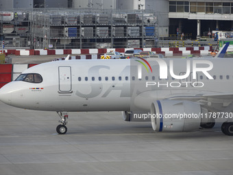 SAS Connect Airbus A320neo aircraft spotted taxiing at London Heathrow Airport LHR in front of the terminal and the air control tower. The m...