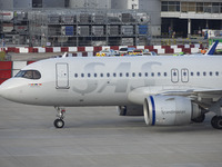 SAS Connect Airbus A320neo aircraft spotted taxiing at London Heathrow Airport LHR in front of the terminal and the air control tower. The m...