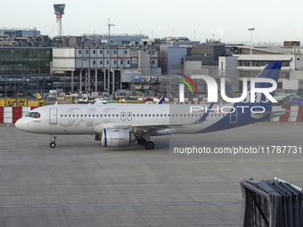 SAS Connect Airbus A320neo aircraft spotted taxiing at London Heathrow Airport LHR in front of the terminal and the air control tower. The m...