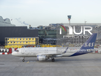 SAS Connect Airbus A320neo aircraft spotted taxiing at London Heathrow Airport LHR in front of the terminal and the air control tower. The m...