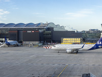 SAS Connect Airbus A320neo aircraft spotted taxiing at London Heathrow Airport LHR in front of the terminal and the air control tower. The m...