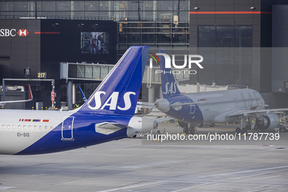 SAS Connect Airbus A320neo aircraft spotted taxiing at London Heathrow Airport LHR in front of the terminal and the air control tower. The m...