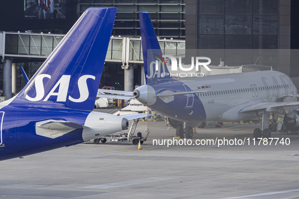 SAS Connect Airbus A320neo aircraft spotted taxiing at London Heathrow Airport LHR in front of the terminal and the air control tower. The m...