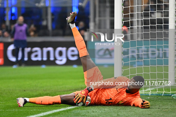 Mike Maignan of France participates in the Group A2 - UEFA Nations League 2024 match between Italy and France at Giuseppe Meazza San Siro St...