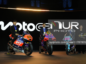 Ai Ogura (L) of Japan and Moto2 champion, Jorge Martin (89) of Spain and MotoGP Champion and David Alonso (80) of Colombia and Moto3 Champio...