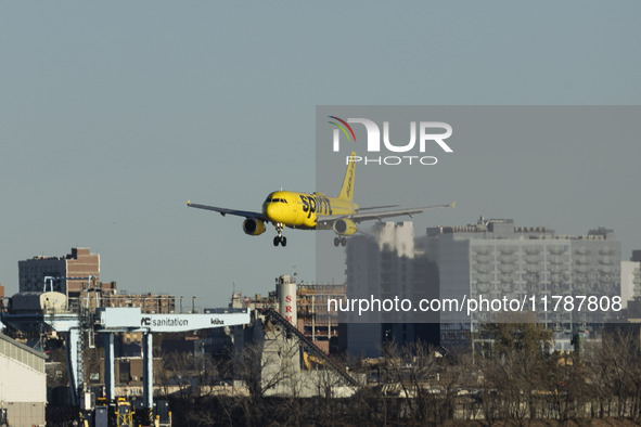 Spirit Airlines Airbus A320 aircraft spotted flying, landing and taxiing in LaGuardia airport. The iconic yellow A320-200 passenger airplane...