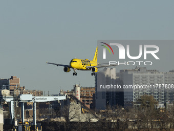 Spirit Airlines Airbus A320 aircraft spotted flying, landing and taxiing in LaGuardia airport. The iconic yellow A320-200 passenger airplane...