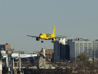 Spirit Airlines Airbus A320 aircraft spotted flying, landing and taxiing in LaGuardia airport. The iconic yellow A320-200 passenger airplane...