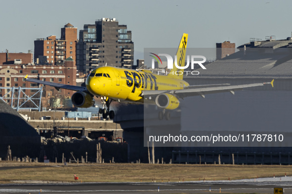 Spirit Airlines Airbus A320 aircraft spotted flying, landing and taxiing in LaGuardia airport. The iconic yellow A320-200 passenger airplane...