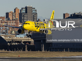 Spirit Airlines Airbus A320 aircraft spotted flying, landing and taxiing in LaGuardia airport. The iconic yellow A320-200 passenger airplane...