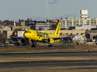 Spirit Airlines Airbus A320 aircraft spotted flying, landing and taxiing in LaGuardia airport. The iconic yellow A320-200 passenger airplane...