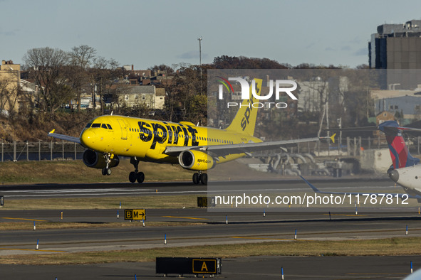 Spirit Airlines Airbus A320 aircraft spotted flying, landing and taxiing in LaGuardia airport. The iconic yellow A320-200 passenger airplane...