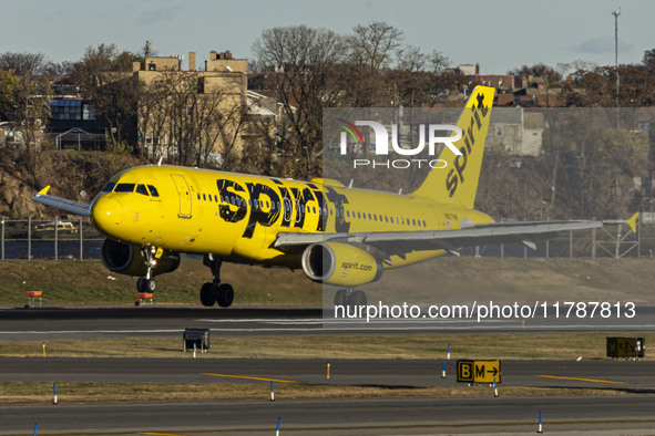 Spirit Airlines Airbus A320 aircraft spotted flying, landing and taxiing in LaGuardia airport. The iconic yellow A320-200 passenger airplane...