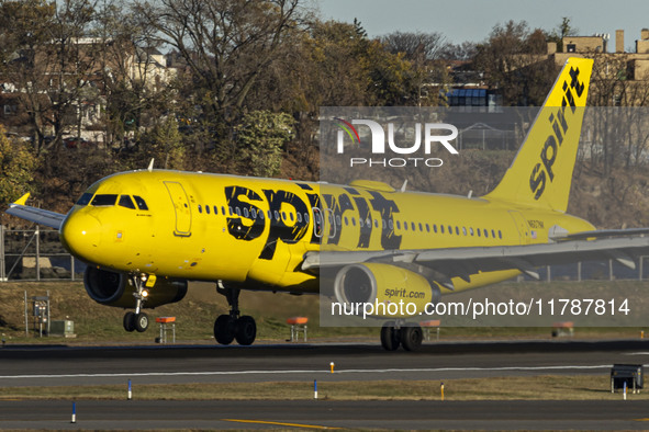 Spirit Airlines Airbus A320 aircraft spotted flying, landing and taxiing in LaGuardia airport. The iconic yellow A320-200 passenger airplane...