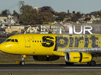 Spirit Airlines Airbus A320 aircraft spotted flying, landing and taxiing in LaGuardia airport. The iconic yellow A320-200 passenger airplane...