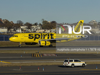 Spirit Airlines Airbus A320 aircraft spotted flying, landing and taxiing in LaGuardia airport. The iconic yellow A320-200 passenger airplane...