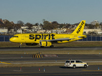 Spirit Airlines Airbus A320 aircraft spotted flying, landing and taxiing in LaGuardia airport. The iconic yellow A320-200 passenger airplane...