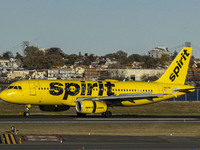 Spirit Airlines Airbus A320 aircraft spotted flying, landing and taxiing in LaGuardia airport. The iconic yellow A320-200 passenger airplane...