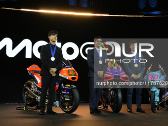 Ai Ogura (L) of Japan and Moto2 champion, Jorge Martin (89) of Spain and MotoGP Champion and David Alonso (80) of Colombia and Moto3 Champio...