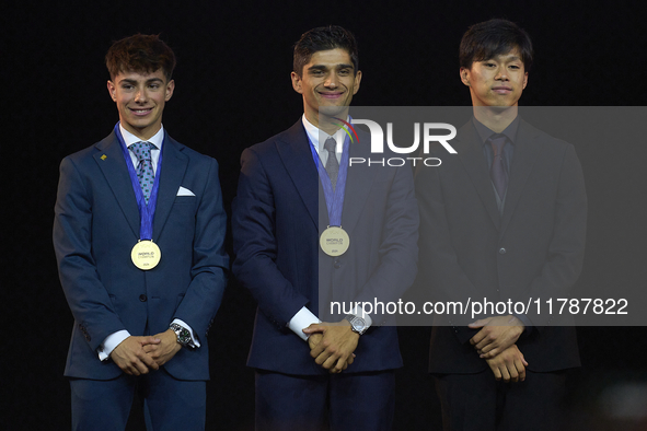 Ai Ogura (R) of Japan and Moto2 champion, Jorge Martin (C) of Spain and MotoGP Champion and David Alonso (L) of Colombia and Moto3 Champion...