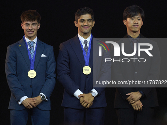 Ai Ogura (R) of Japan and Moto2 champion, Jorge Martin (C) of Spain and MotoGP Champion and David Alonso (L) of Colombia and Moto3 Champion...